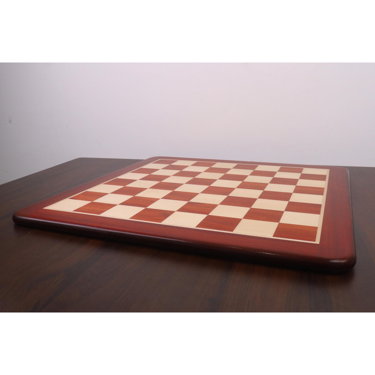 Low-angle wide shot of the 25 inch large chess board showing the expansive playing surface.