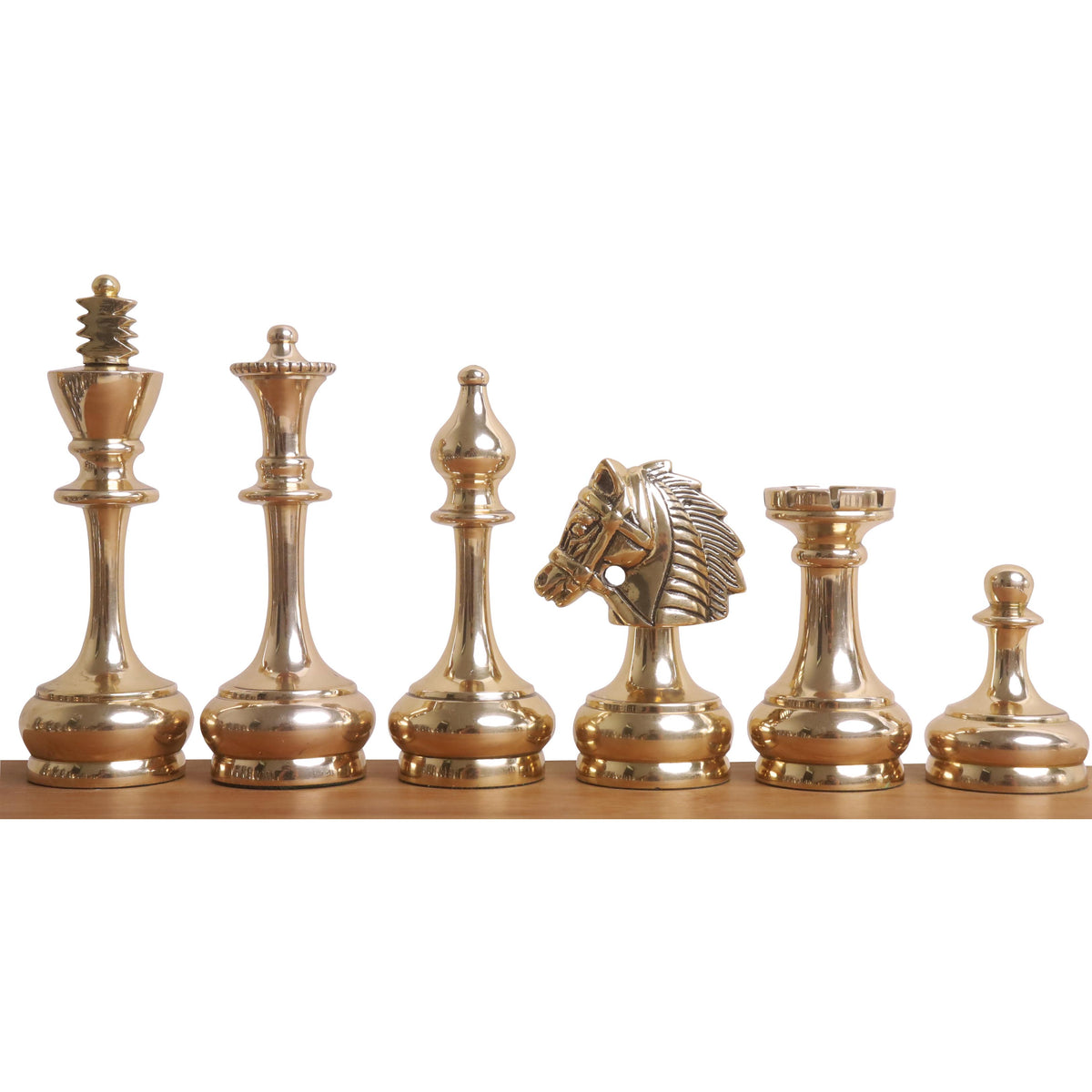 Lineup of gold Splendor Series brass luxury chess pieces, featuring the king, queen, bishop, knight, rook, and pawn.
