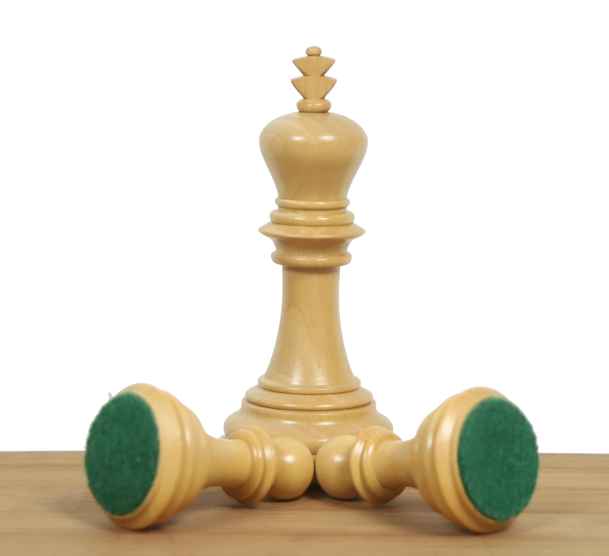 Boxwood Imperial Staunton King and two Knights showing green felt bases.