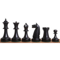 Detailed view of black 1900s American Chess Company pieces.