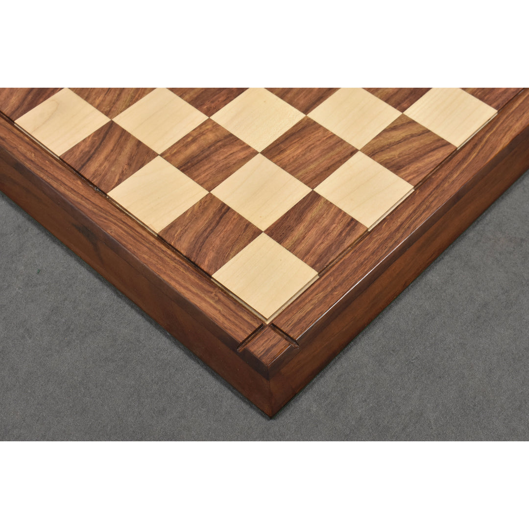 Corner view of a matte finish wooden chess board with 55mm squares and a raised border design.