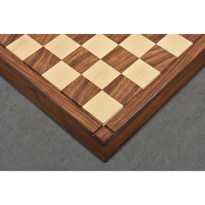 Corner view of a matte finish wooden chess board with 55mm squares and a raised border design.