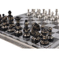 Handcrafted 12-inch brass metal chess set featuring black and silver Staunton-inspired pieces on an engraved board.
