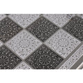Close-up of decorative circular and floral etchings on the surface of the 12-inch metal chess board.
