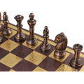 Top-down macro shot of the copper king, queen, and bishops on the ornate copper and gold board.
