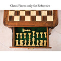 Top-down view of the storage drawer with green felt lining showing neatly arranged chess pieces (pieces for reference only).