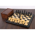 3.3" Tournament Staunton chess pieces in ebonised boxwood set up on a board next to a wooden storage box.