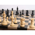 Perspective view of weighted boxwood chess pieces positioned on a dark wooden chess board.