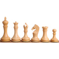 Complete lineup of minimalist boxwood chess pieces shown from king to pawn.
