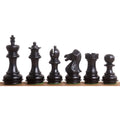 Full set of ebonised boxwood Laughing Knight Staunton chess pieces including the iconic carved knight.
