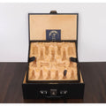 Open black leatherette storage box showing velvet padded inserts and gold Royal Chess Mall logo inside the lid.