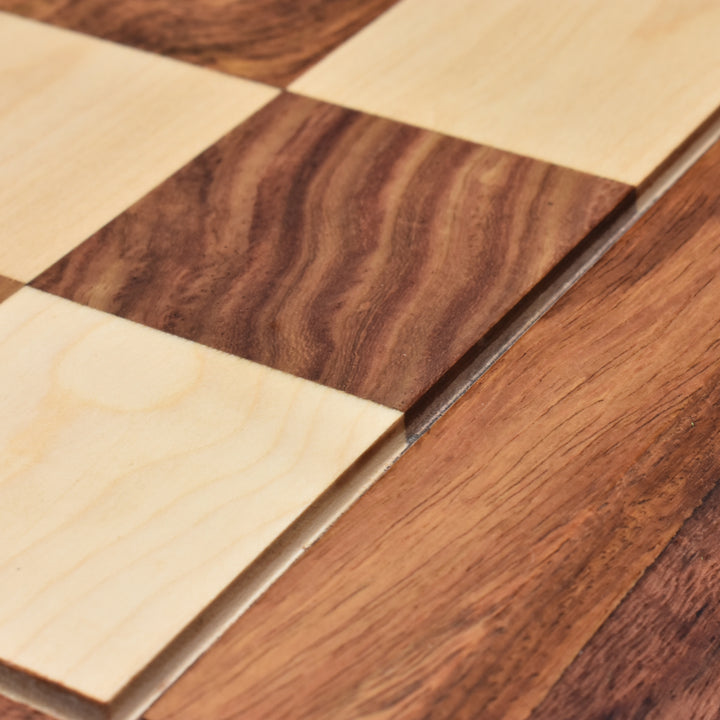 Macro shot of the natural wood grain texture of golden rosewood and maple chess board squares.