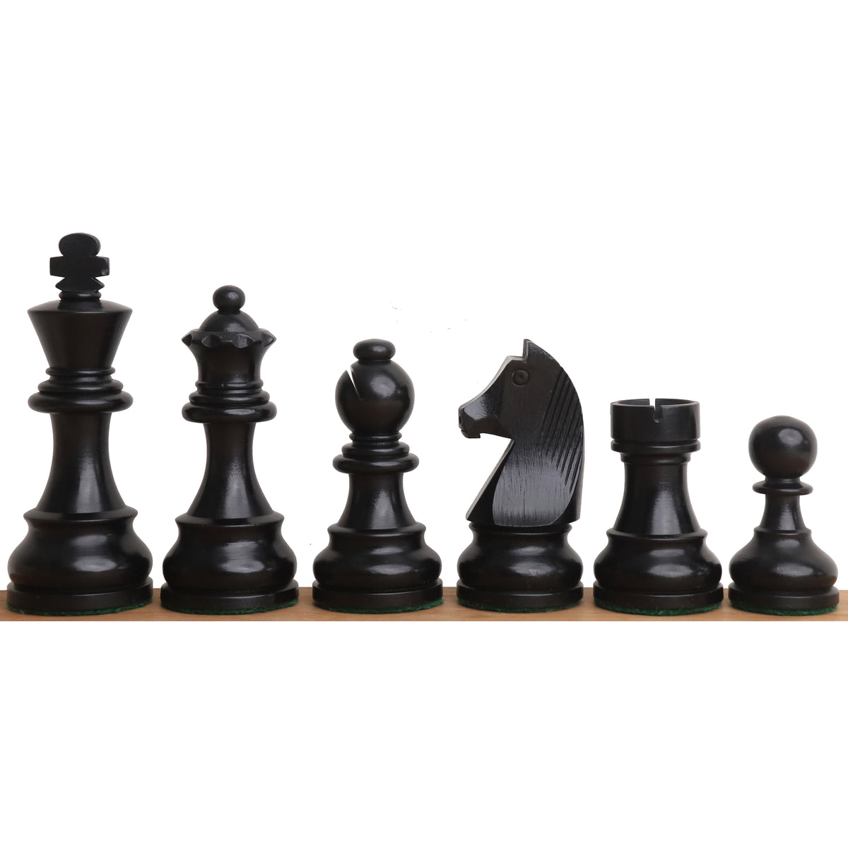 Complete set of polished ebonized tournament chess pieces standing in a clean row.