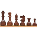 Dark golden rosewood 3.8" Bundesform German Staunton chess pieces lined up by size.