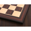 Detailed view of the decorative multi-line border on a Tiger Ebony and Maple wood printed chess board.