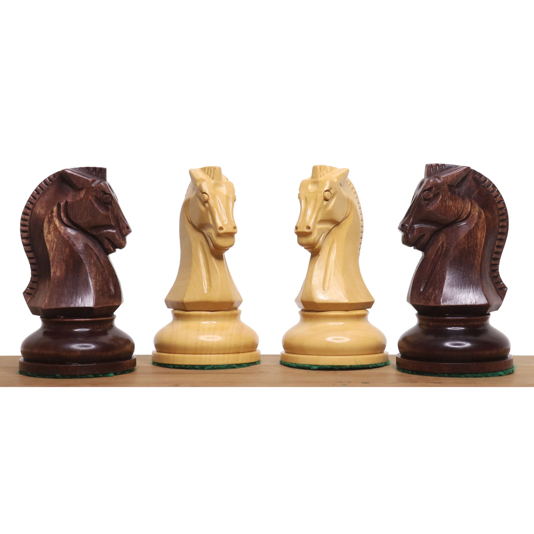 Four Fischer Dubrovnik chess knights in mahogany stained and natural boxwood finishes.