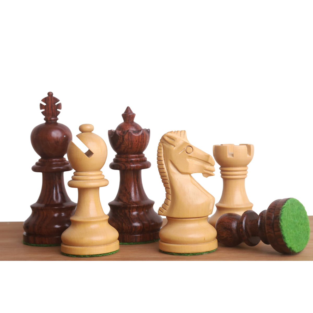 Grouping of intricately detailed Taj Mahal Staunton chess pieces in rosewood and boxwood.