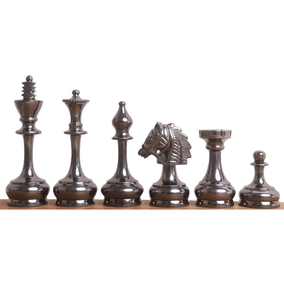 Lineup of metallic grey Splendor Series brass chess pieces, showing the king, queen, bishop, knight, rook, and pawn.