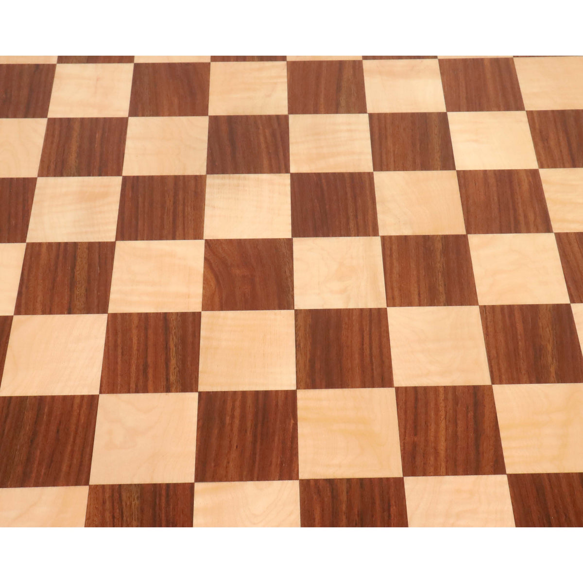 Top-down detail of the natural wood grain on the Golden Rosewood and Maple checkered surface of the chess board.