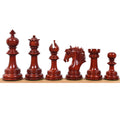 Full side profile lineup of the rich crimson bud rosewood Arthur Staunton chess pieces displaying premium polish.