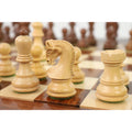 Handcrafted Russian Zagreb boxwood knight on a professional wooden chessboard.