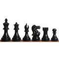 Profile view of black Pro Staunton 3 inch wooden chess pieces against a white background.