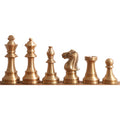 Complete lineup of antique brass Pro Staunton metal chess pieces arranged from king to pawn.