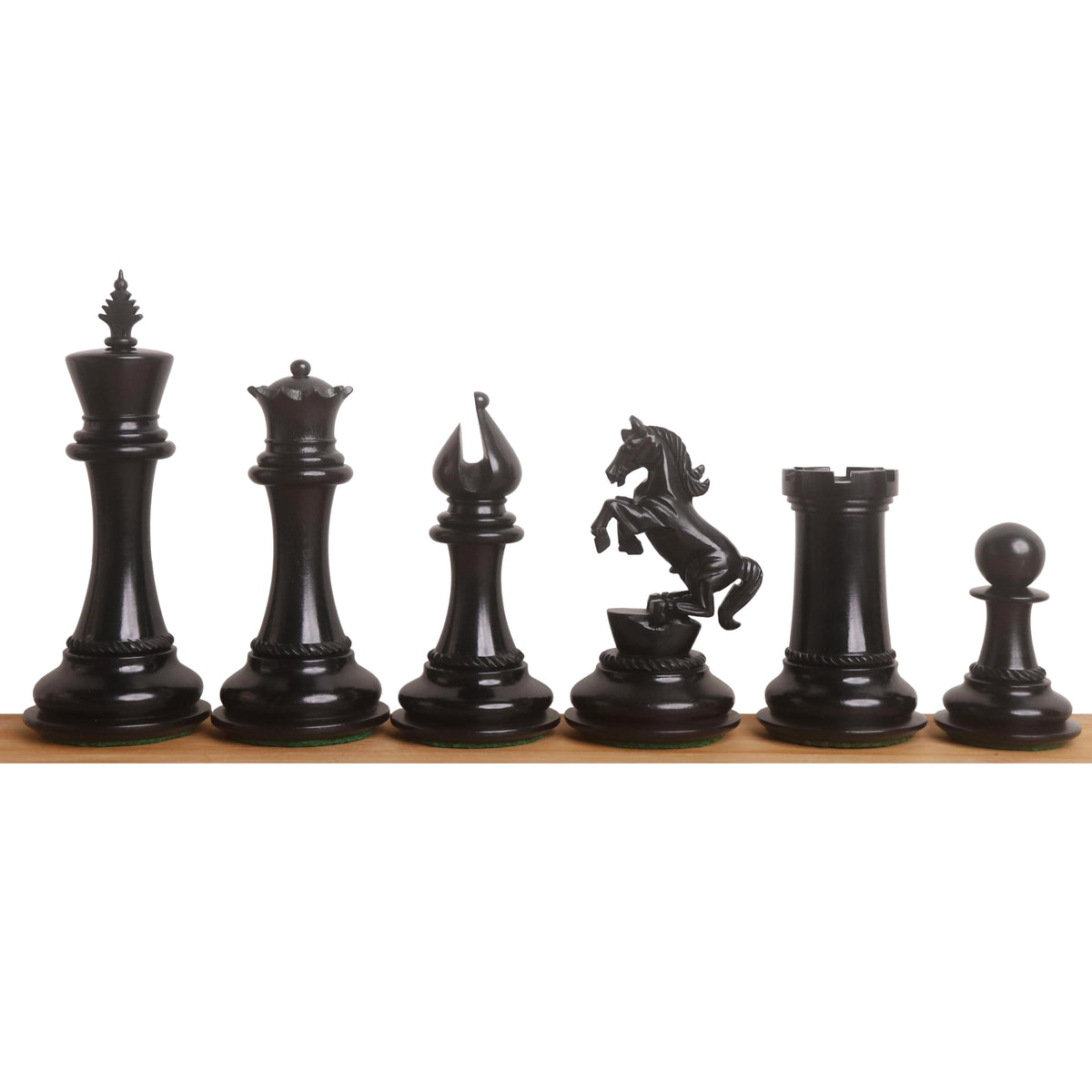 High-end ebony wood Incitatus luxury Staunton chess pieces neatly lined up on a smooth wooden base.