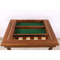 Close-up top-down view of the empty, felt-lined drawer extended over the chessboard.