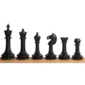 Sequential lineup of dark ebonised pieces from the 3.5-inch Monolith miniature chess set.