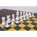 White and green Pro Staunton weighted chess pieces ready for play on a board.