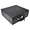 Angled view of the closed black leatherette chess storage box with a silver lock, keeping pieces secure.