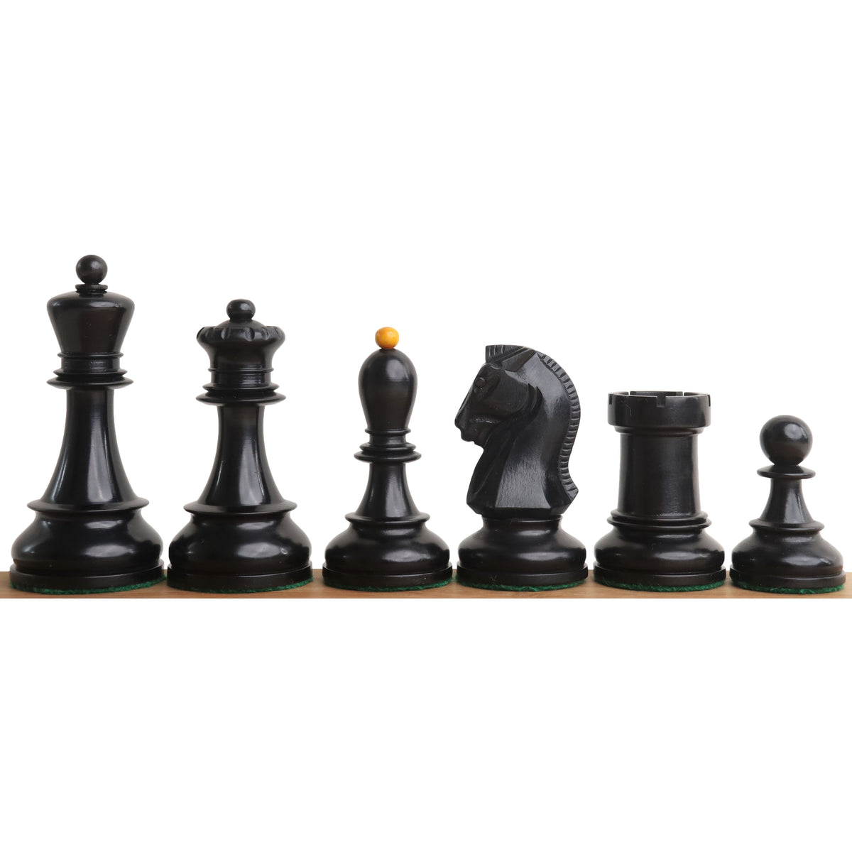 Close-up of black antiqued boxwood 1950s Fischer Dubrovnik chess pieces.