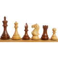 Six Fierce Knight Staunton chess pieces in alternating golden rosewood and boxwood.