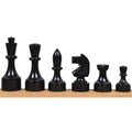 Six dark ebonised boxwood Bundesform alternative chess pieces arranged neatly against a plain background.