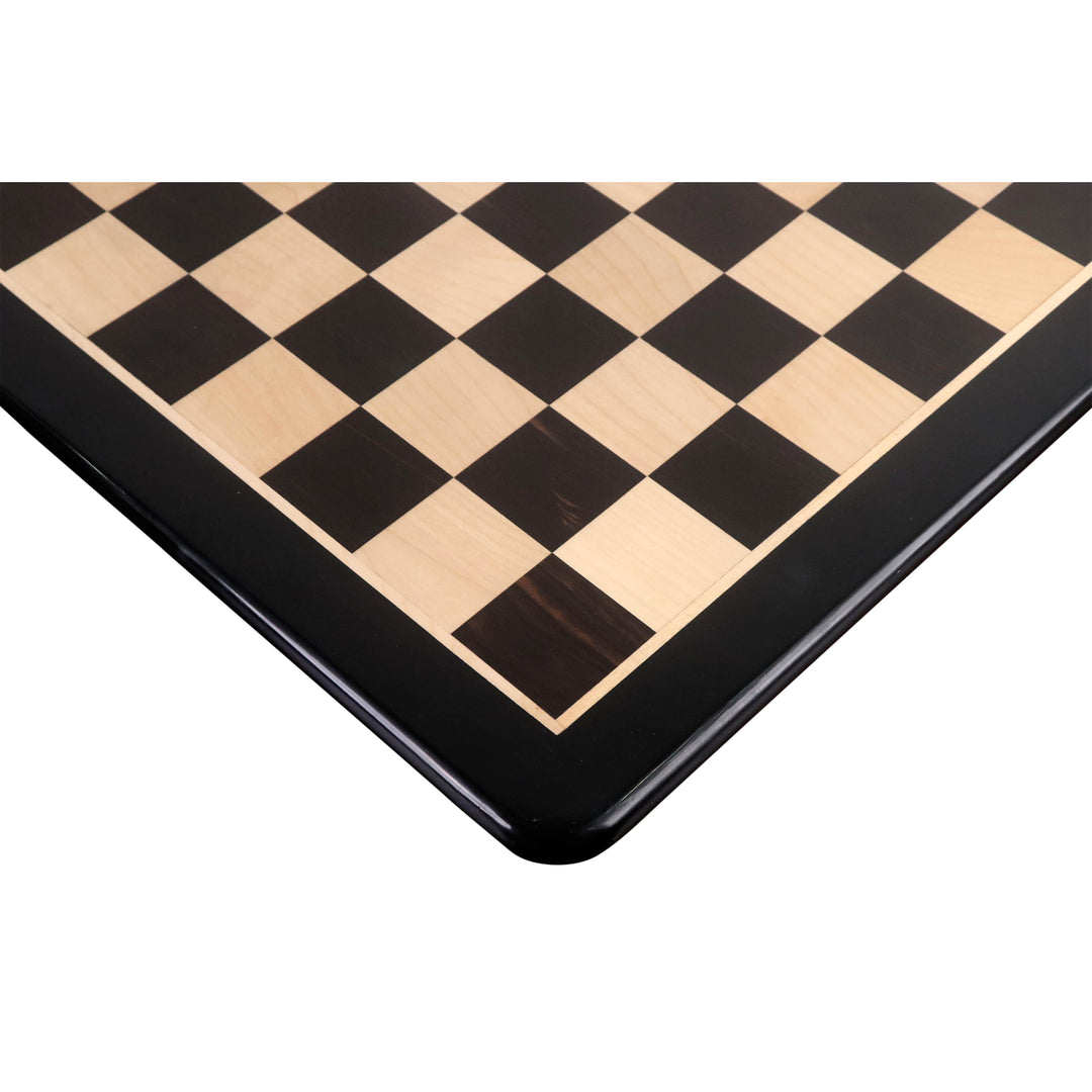 Corner detail of a 21-inch ebony and maple wood chessboard with a matte finish.