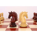 Hand-carved budrose and boxwood knights from the 4.5-inch Carvers' Art luxury set.