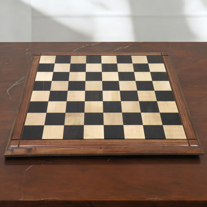 Overhead perspective of polished ebony wood chess board squares