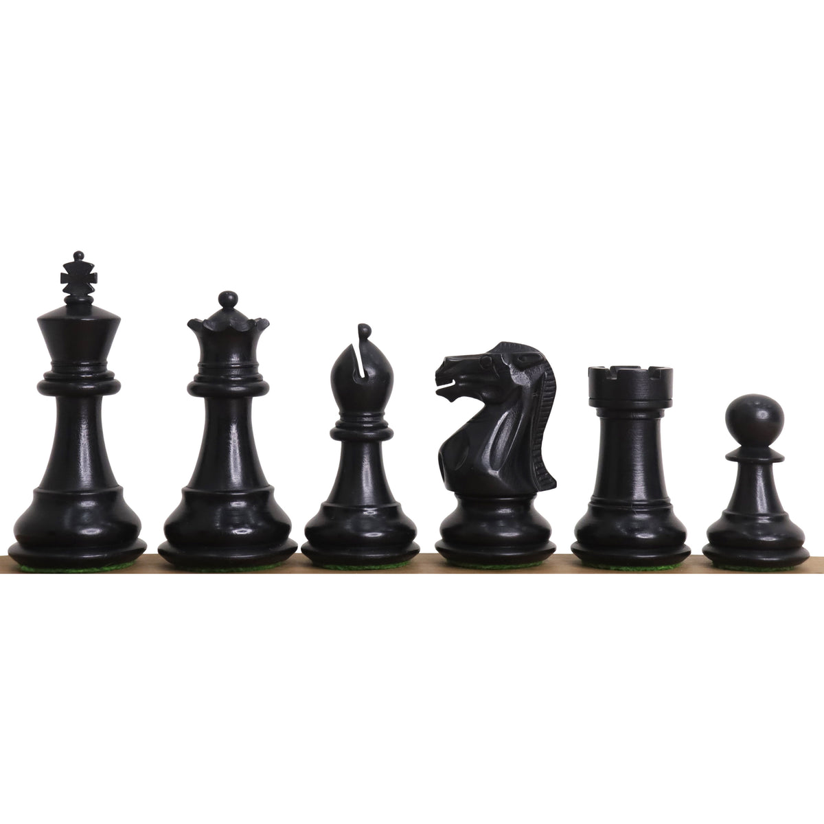 Sleek ebonised boxwood chess pieces from the 3 inch Professional Staunton collection in a row.