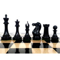 Dark ebony Sleek Staunton chess pieces in profile view on an ebony chessboard.