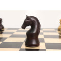 A close-up profile of a finely carved mahogany-stained Piatigorsky Cup chess knight.