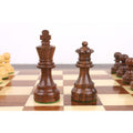 Dark golden rosewood King and Queen pieces from the 3.3 inch tournament Staunton set on a board.