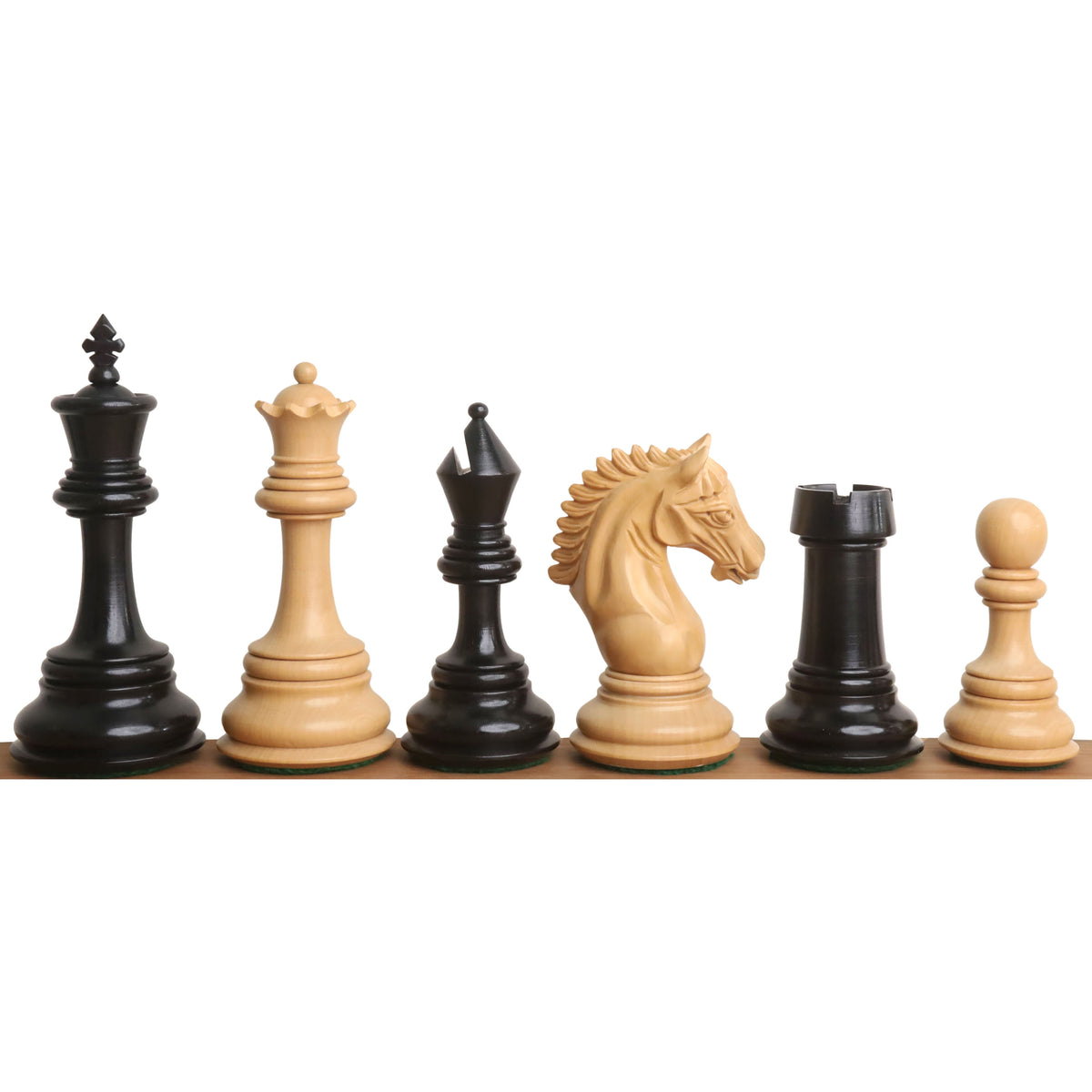 Diverse selection of ebony and boxwood Tilted Knight chess pieces in a row.