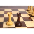 Side-by-side comparison of boxwood and rosewood rooks from the 3.5" Monolith miniature chess set.