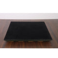 Underside of the green and maple chess board featuring a protective black felt lining.