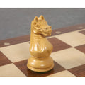 Detailed view of the carved boxwood knight in the Queens Gambit design.