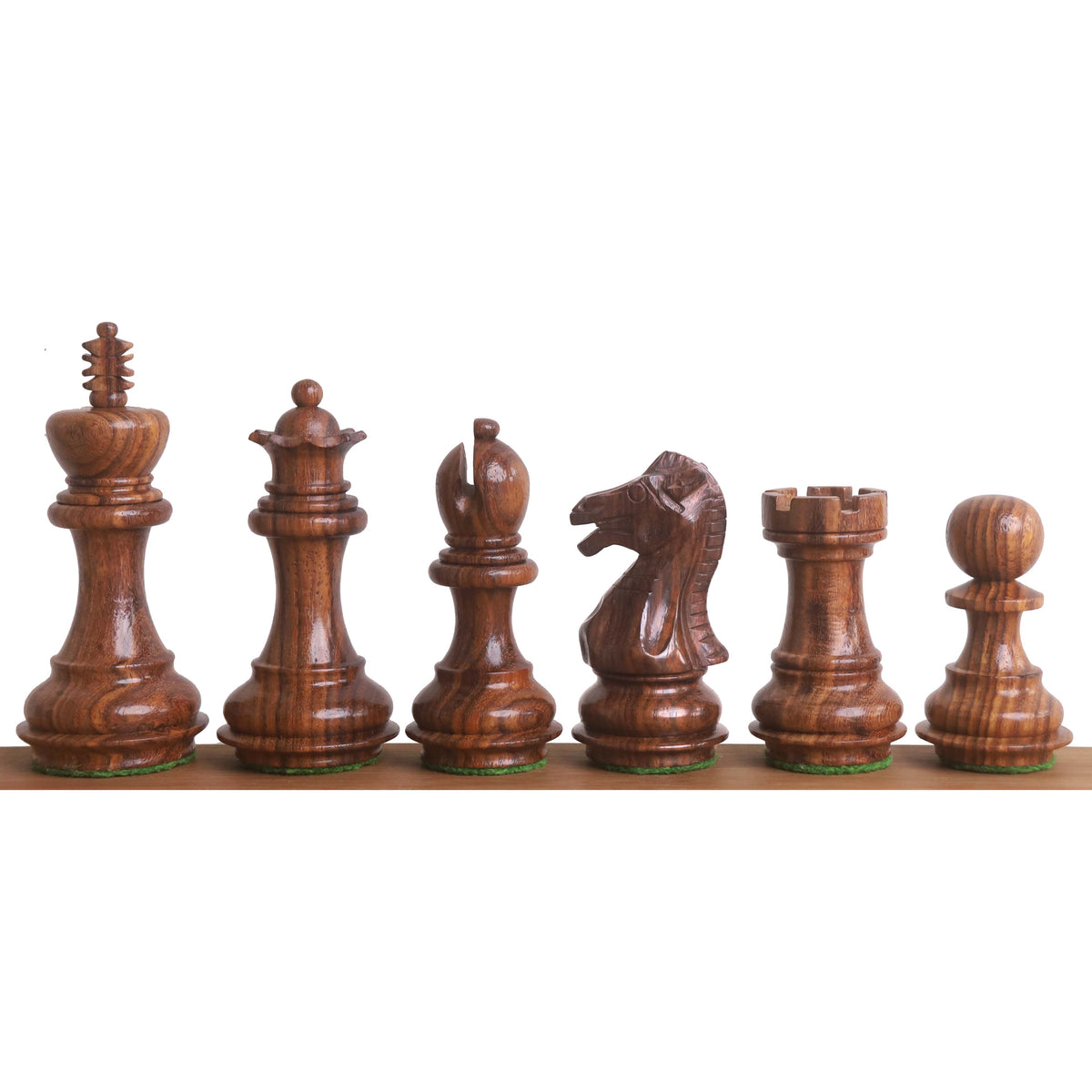 Weighted golden rosewood Staunton chess pieces showing grain and hand-carved details.