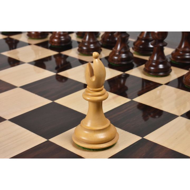 Handcrafted boxwood bishop chess piece standing on a luxury wooden chess board.