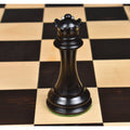 Hand-carved black ebony wood queen chess piece on a solid wood tournament chess board.