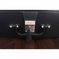 Detailed view of the polished metal lock and handle on a luxury black leatherette chess storage case.